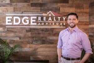 leasing housing for Brighton, Massachusetts - EDGE Realty Matt Gorman standing before EDGE masthea